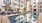 a pool in a courtyard between buildings