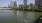 a body of water with a boat in it and a city in the background